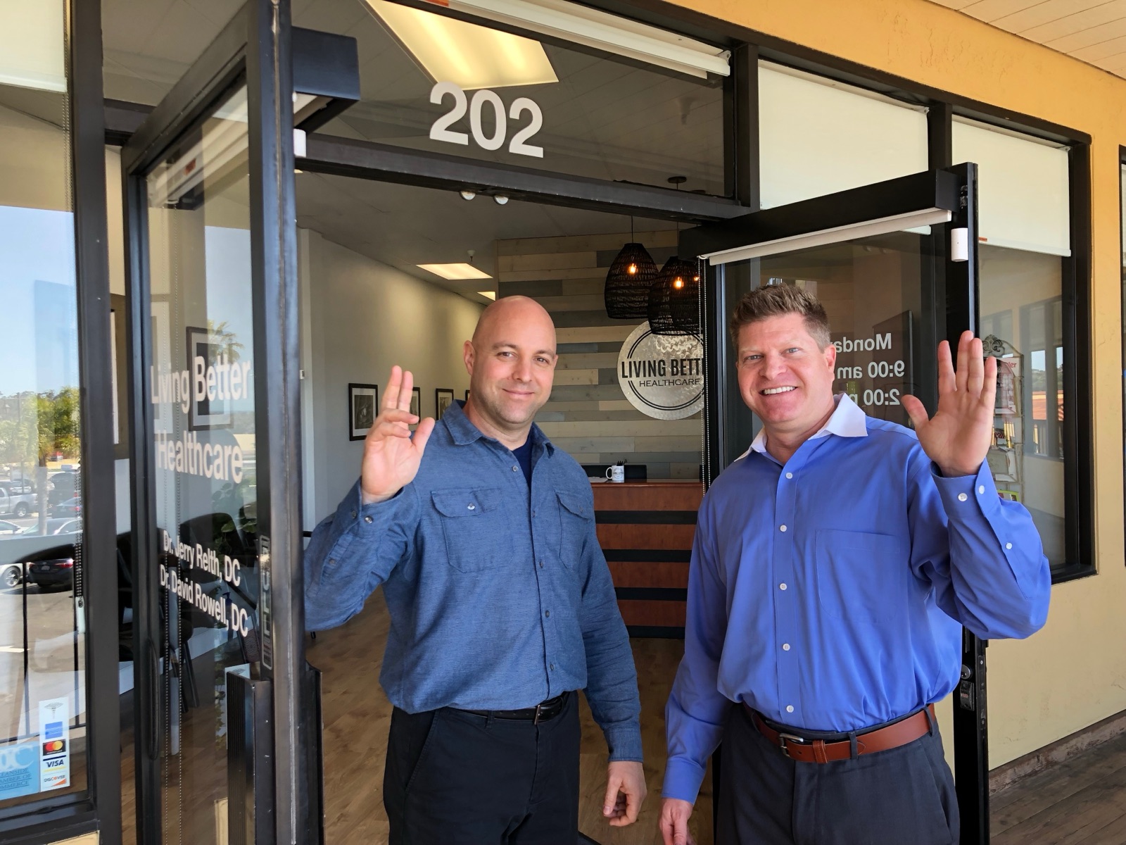Dr. Jerry Relth and Dr. David Rowell at the entrance of Living Better Healthcare in California